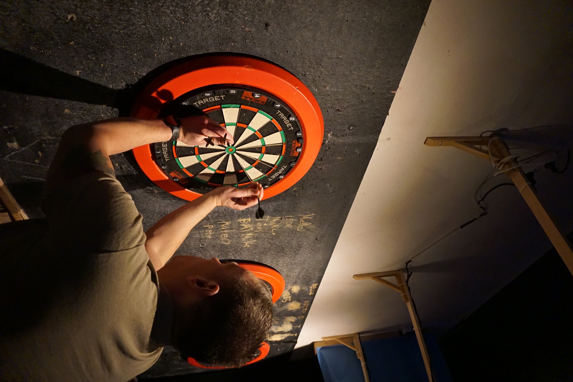 Darts in play in the middle of the room.