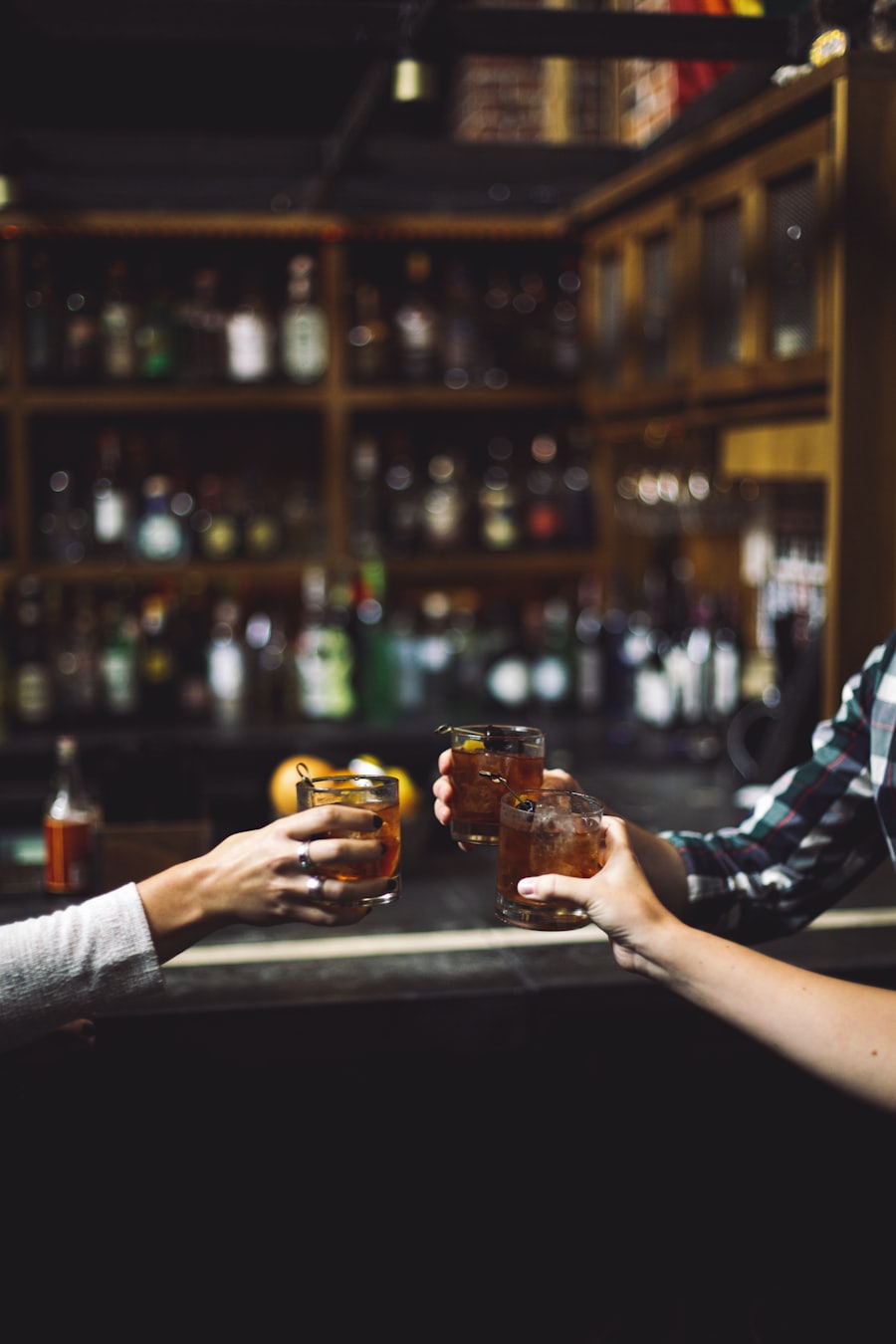 Guests clinking glasses in front of the bar.