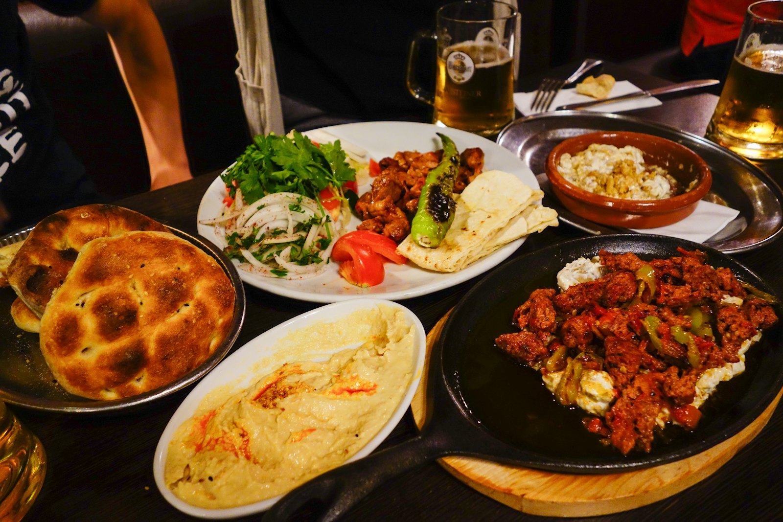 A table covered with several dishes ready to share.